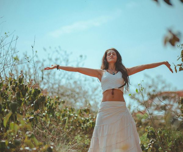 Person meditating peacefully in a calm environment.